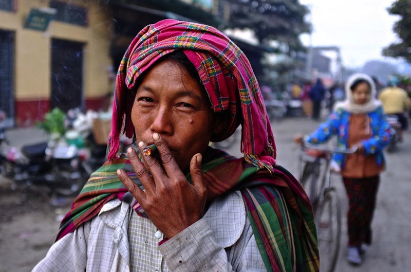 Woman smoking a cheroot , Myanmar