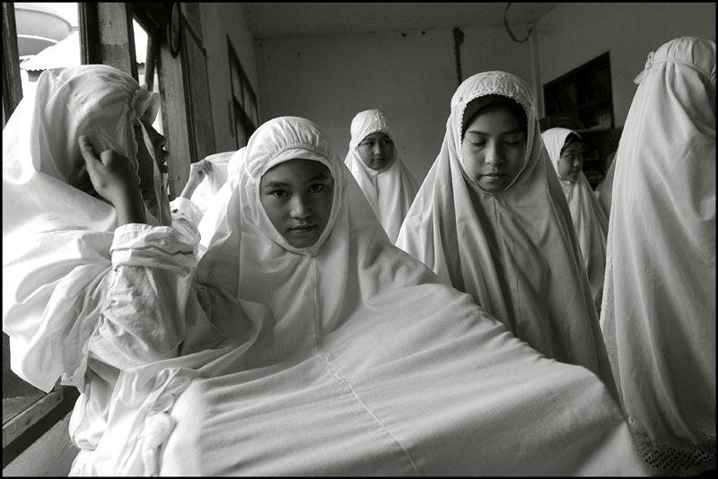 Girls getting ready for the midday prayer at an orphanage in Banda Aceh Indonesia