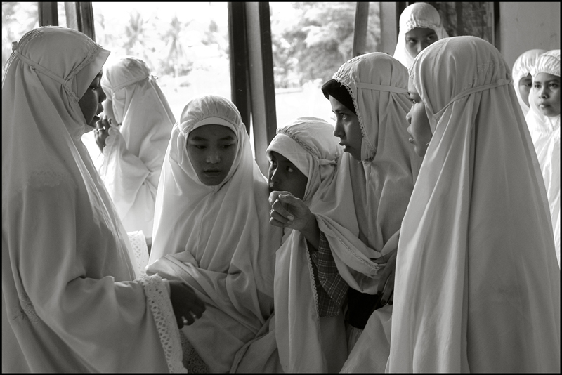 Girls prepare themselves for the midday prayer at an orphanage in Banda Aceh Indonesia