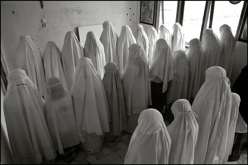 Girls during the midday prayer at an orphanage in Banda Aceh Indonesia