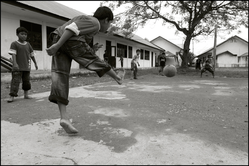 Boys play football at an orphanage in Banda Aceh Indonesia