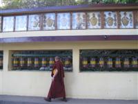 A monk does the Prayer wheels