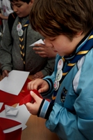 Boy Scout makes an origami crane