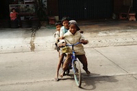 three kids on the bike