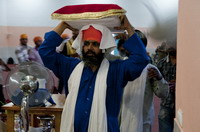 Guru Granth Sahib is taken to the bed