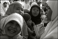A student (right) from the Fajar Hidayah organization with some girls at an orphanage in Banda Aceh Indonesia