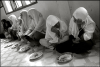 Girls having their lunch at an orphanage in Banda Aceh Indonesia
