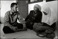 Two teachers try to talk with this girl, who is still in grieve a year after the Tsunami