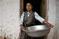 A local woman performing her daily duties in one of the households in Upper Mustang