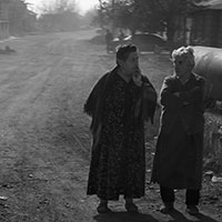 The women in conversation on the side of the road