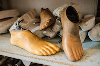 Prosthetic feet and molds for their production line