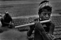 Shafik (11) loves to play flute whenever he gets time