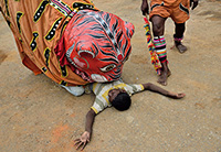 tiger eating a boy during the dance drama